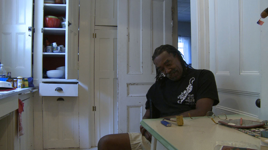 Edward 'Bo' Whaley shares his story at his kitchen table (photo by Sean Gallagher)